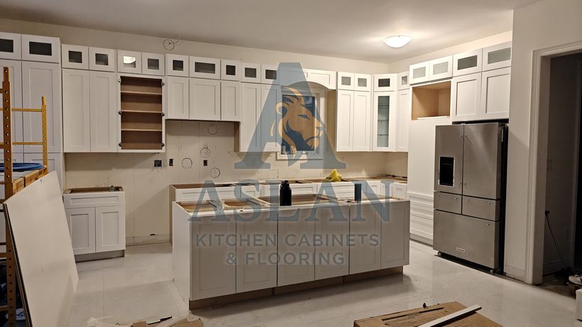 Kitchen installation in progress with island cabinets set before countertops