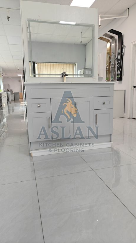 Grey shaker vanity with drawers, doors and brushed nickel hardware